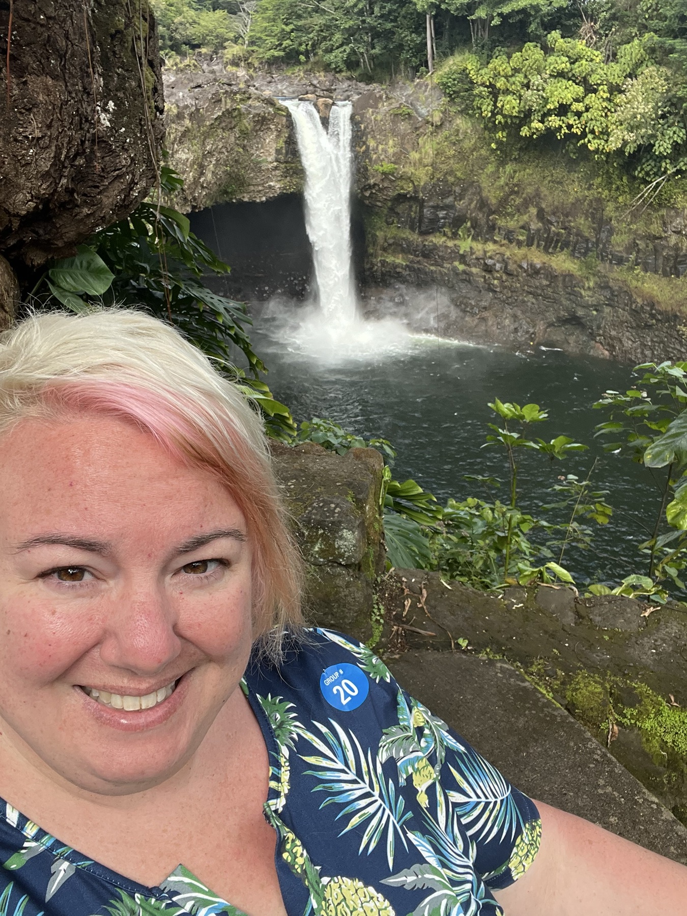 Jenn visiting a tropical waterfall